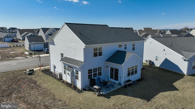 birds eye view of property with a residential view