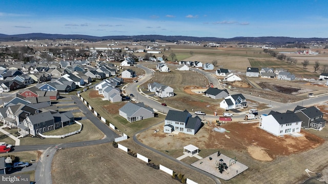 birds eye view of property with a residential view