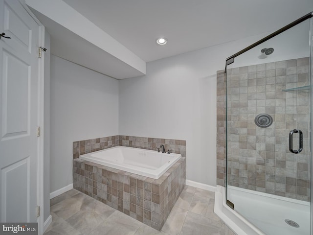 full bath with recessed lighting, a stall shower, tile patterned flooring, baseboards, and a bath