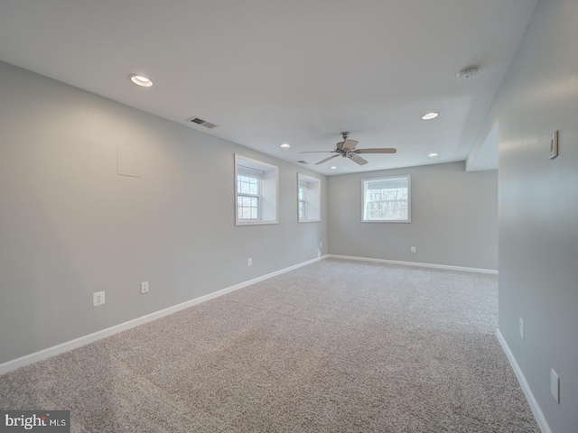 unfurnished room featuring recessed lighting, carpet, visible vents, and baseboards