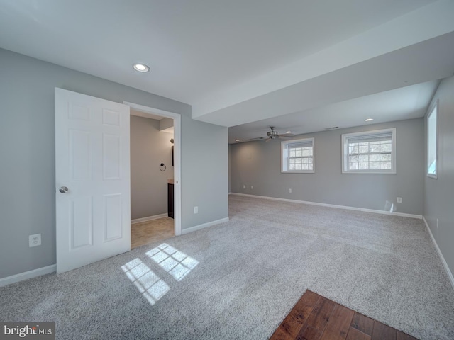 spare room with carpet, recessed lighting, and baseboards