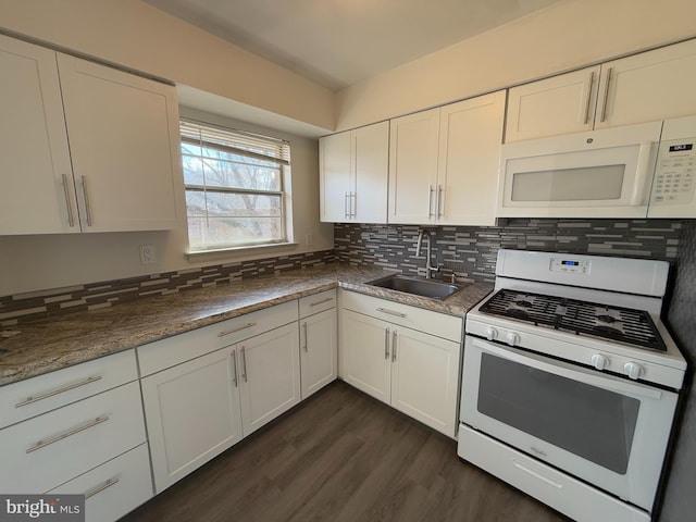 kitchen featuring backsplash, white appliances, sink, and white cabinets