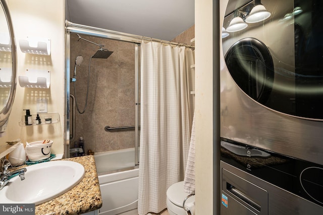 bathroom featuring toilet, shower / tub combo, and vanity