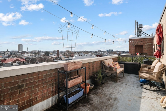 view of patio featuring a balcony