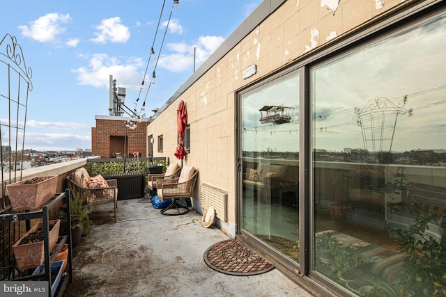 balcony featuring an outdoor living space with a fireplace