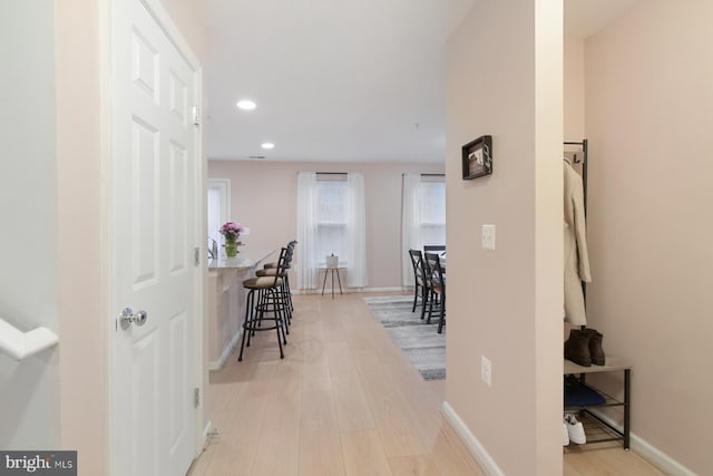 hall with light hardwood / wood-style flooring