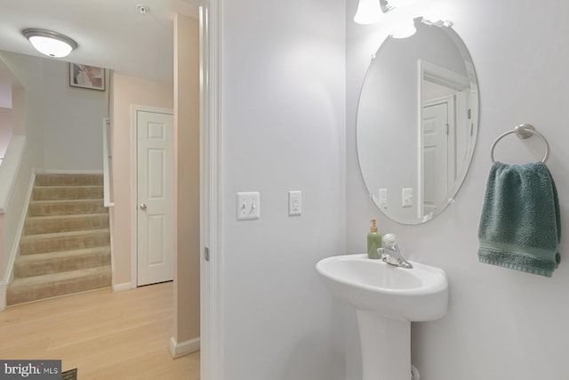 bathroom with wood-type flooring and sink