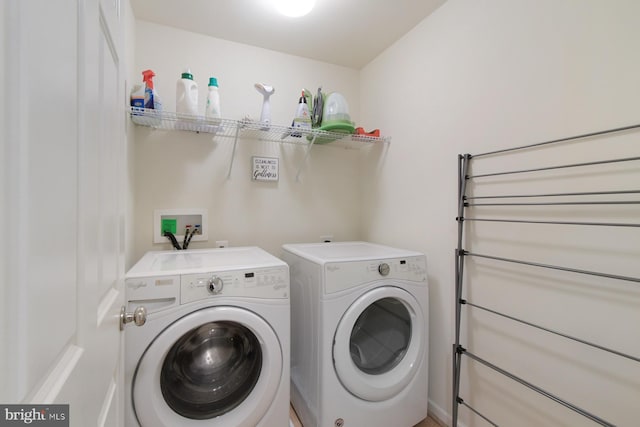 laundry area with independent washer and dryer