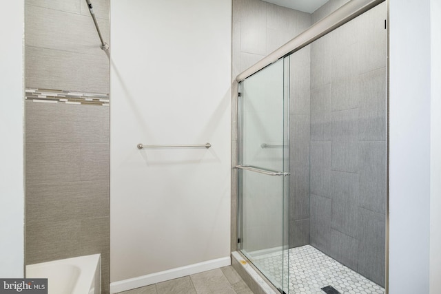 2941 Cecil B Moore Ave, Philadelphia, PA 19121 - bathroom with a stall shower, a bathtub, and tile patterned floors