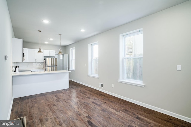2941 Cecil B Moore Ave, Philadelphia, PA 19121 - kitchen featuring a peninsula, recessed lighting, pendant lighting, white cabinets, and dark wood finished floors