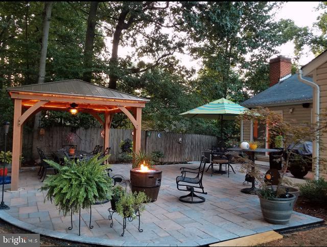 view of patio / terrace with a gazebo and an outdoor fire pit