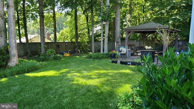 view of yard with a gazebo and a patio