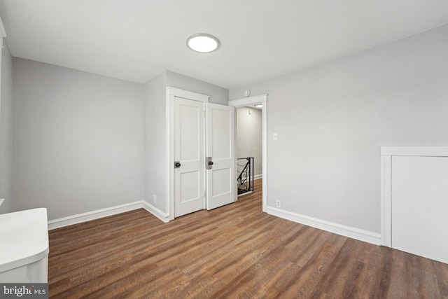 interior space with dark hardwood / wood-style floors