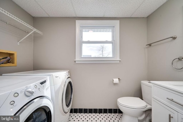 laundry area with washing machine and clothes dryer