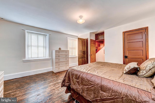 bedroom featuring dark wood-type flooring