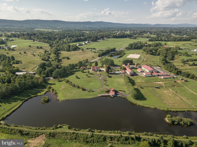 drone / aerial view featuring a water view and a rural view