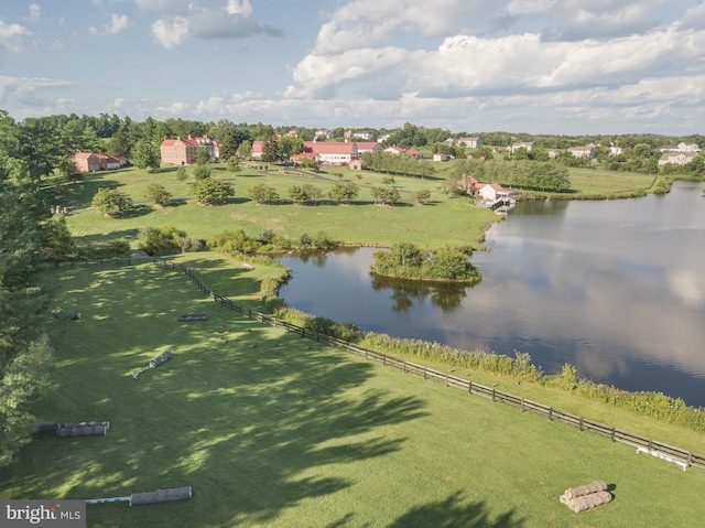 drone / aerial view featuring a water view and a rural view