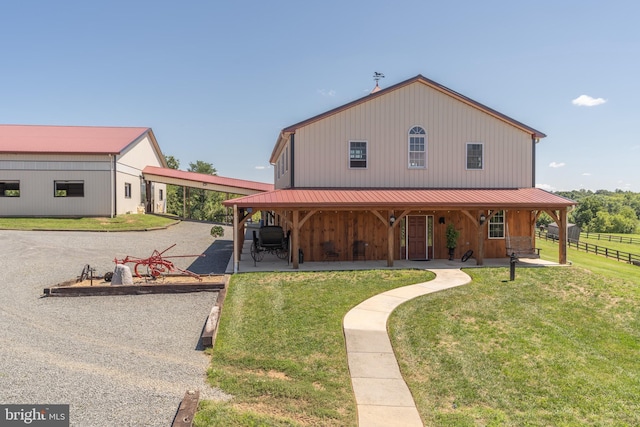 country-style home with a front yard