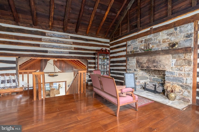 unfurnished living room featuring hardwood / wood-style floors, wood ceiling, and high vaulted ceiling