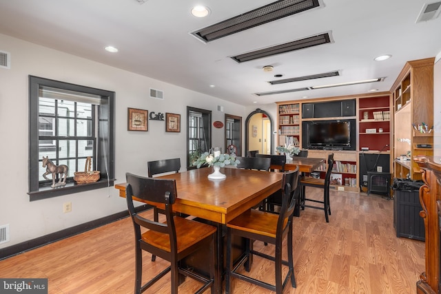 dining space with light wood-type flooring