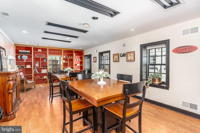 dining area featuring light wood-type flooring