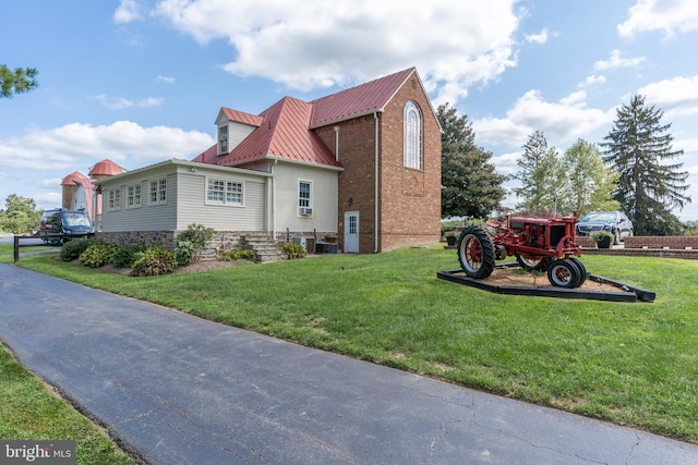 view of property exterior with a lawn