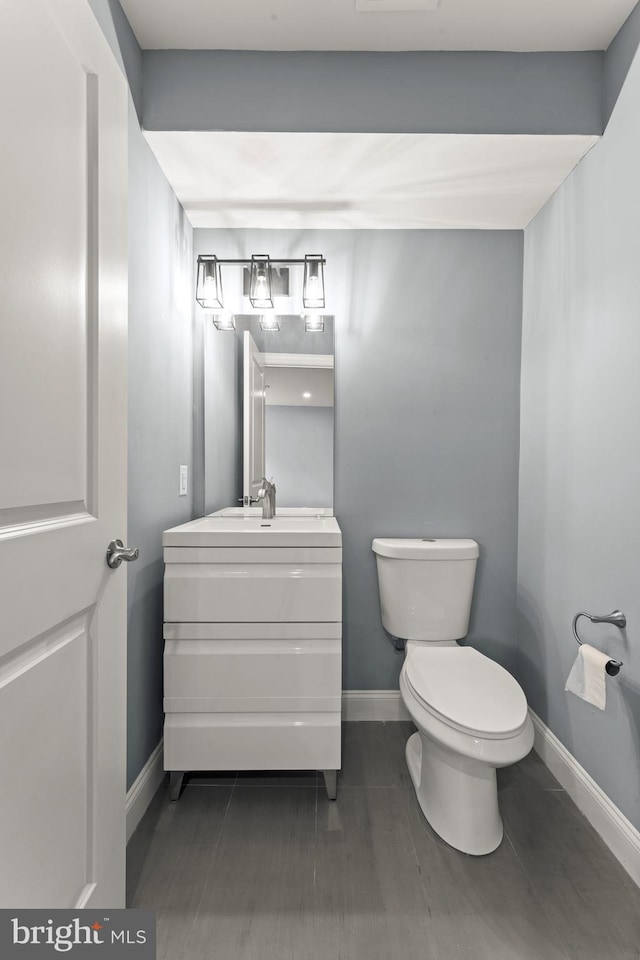 bathroom with vanity and toilet