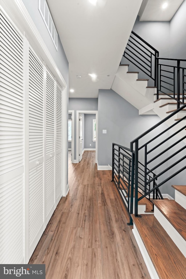 hallway with wood-type flooring