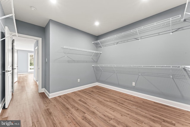 walk in closet featuring hardwood / wood-style floors