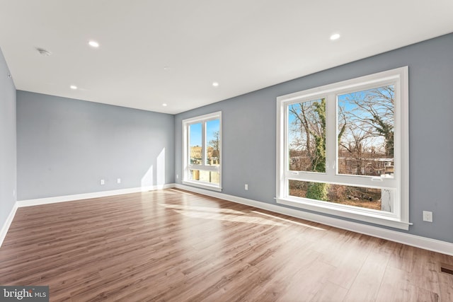 spare room with light wood-type flooring