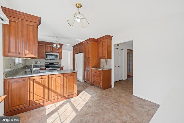 kitchen with light stone counters, sink, backsplash, and appliances with stainless steel finishes