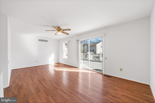 empty room with ceiling fan and wood-type flooring