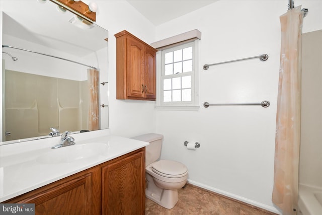 bathroom featuring vanity, toilet, and a shower with shower curtain