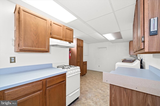 kitchen with sink, a drop ceiling, and gas range gas stove