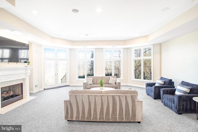 7024 Green Oak Dr, Mclean, VA 22101 - carpeted living room featuring a fireplace with flush hearth, recessed lighting, baseboards, and french doors