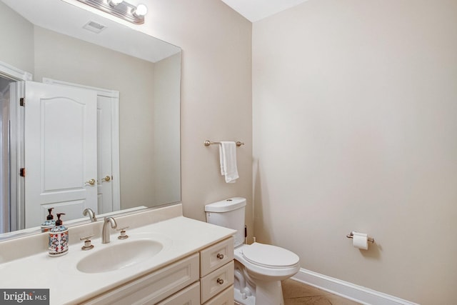 7024 Green Oak Dr, Mclean, VA 22101 - half bath with toilet, vanity, tile patterned floors, and baseboards