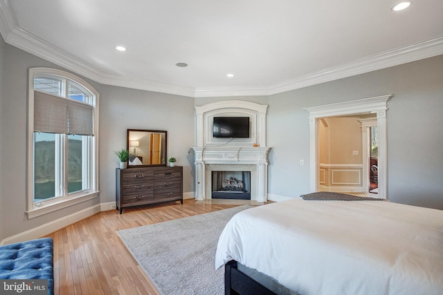 7024 Green Oak Dr, Mclean, VA 22101 - bedroom featuring crown molding, a fireplace with flush hearth, light wood-type flooring, recessed lighting, and baseboards