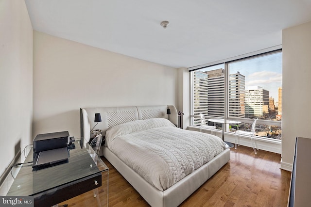 bedroom featuring dark hardwood / wood-style flooring