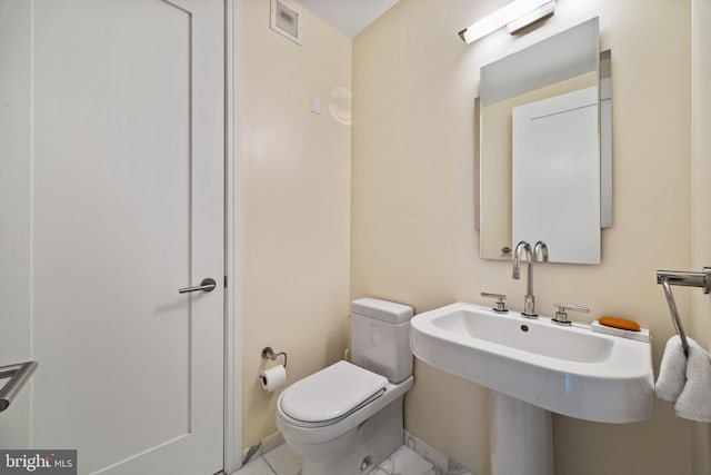 bathroom featuring toilet