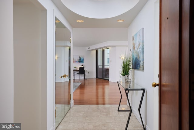 hallway with light tile patterned floors