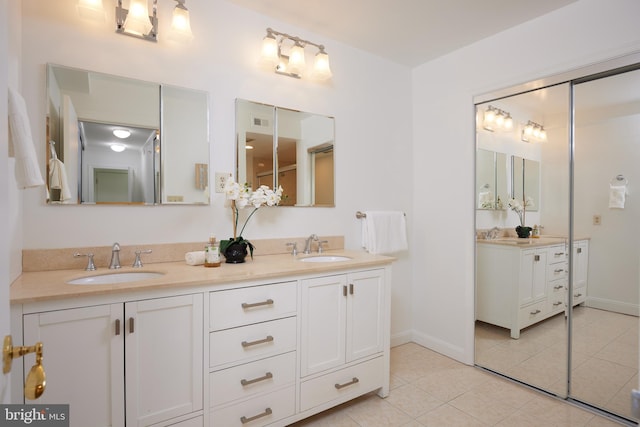 bathroom with vanity and tile patterned flooring