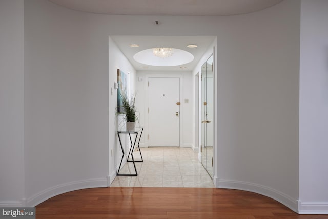 hallway with light hardwood / wood-style flooring