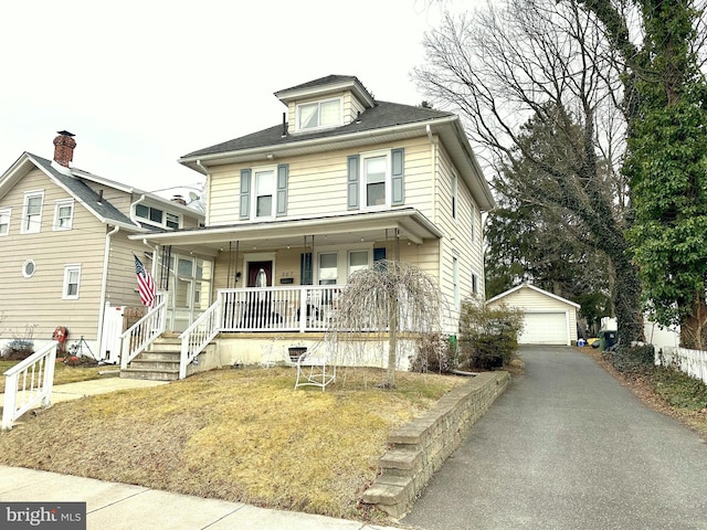 view of front of house with a garage, an outdoor structure, and covered porch