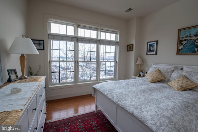 bedroom with wood-type flooring