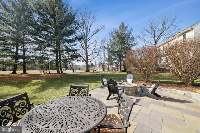 view of patio with a fire pit