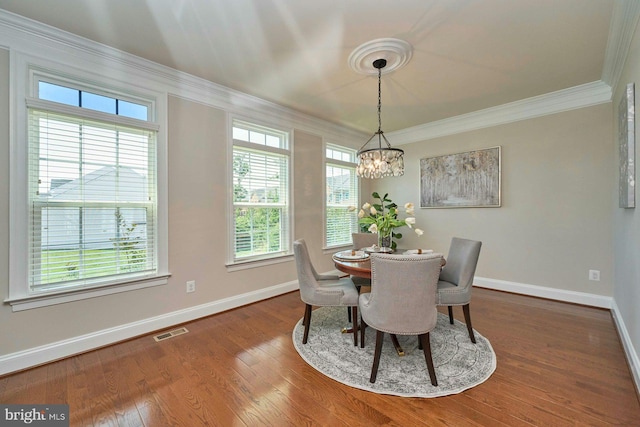 7916 Culloden Crest Ln, Gainesville, VA 20155 - dining space with a chandelier, crown molding, and wood finished floors