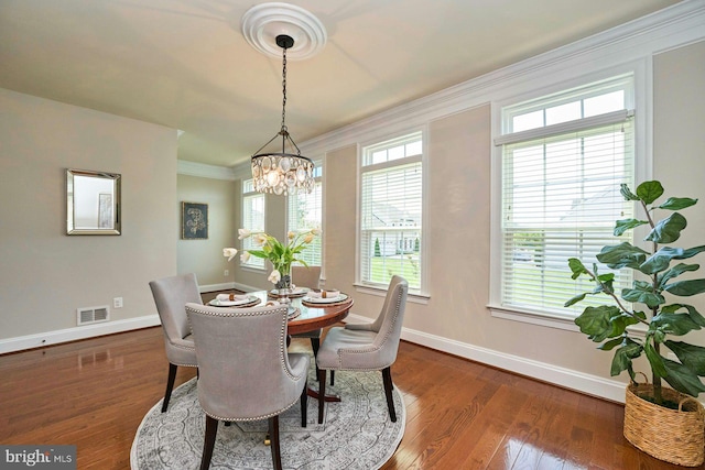 7916 Culloden Crest Ln, Gainesville, VA 20155 - dining area featuring a chandelier, dark wood-style flooring, and ornamental molding