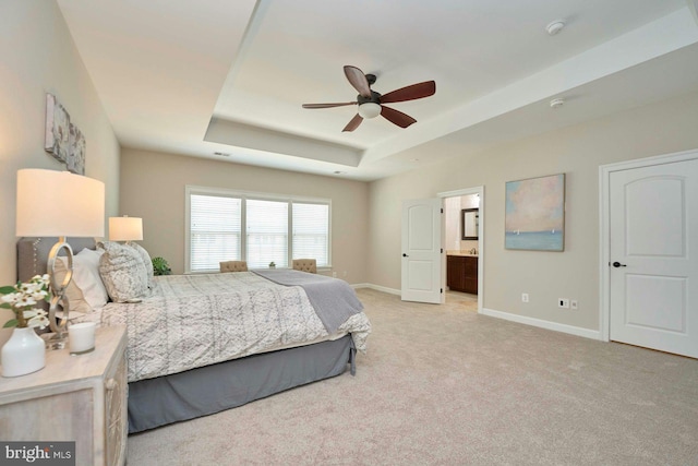 7916 Culloden Crest Ln, Gainesville, VA 20155 - bedroom featuring a raised ceiling, light colored carpet, connected bathroom, and a ceiling fan