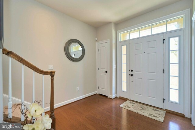 7916 Culloden Crest Ln, Gainesville, VA 20155 - foyer entrance with dark wood-style flooring and stairway