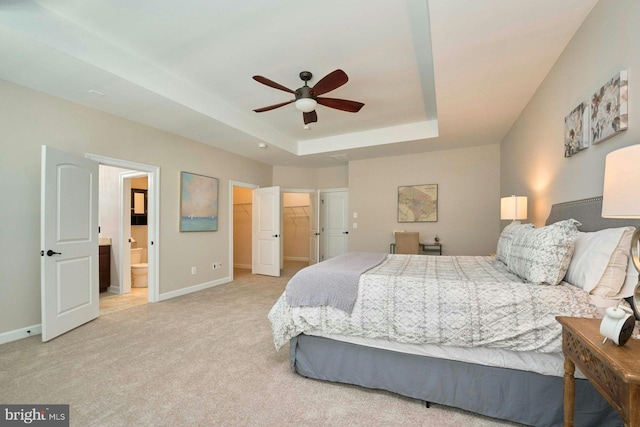 7916 Culloden Crest Ln, Gainesville, VA 20155 - bedroom with a raised ceiling, carpet floors, ensuite bathroom, a spacious closet, and ceiling fan